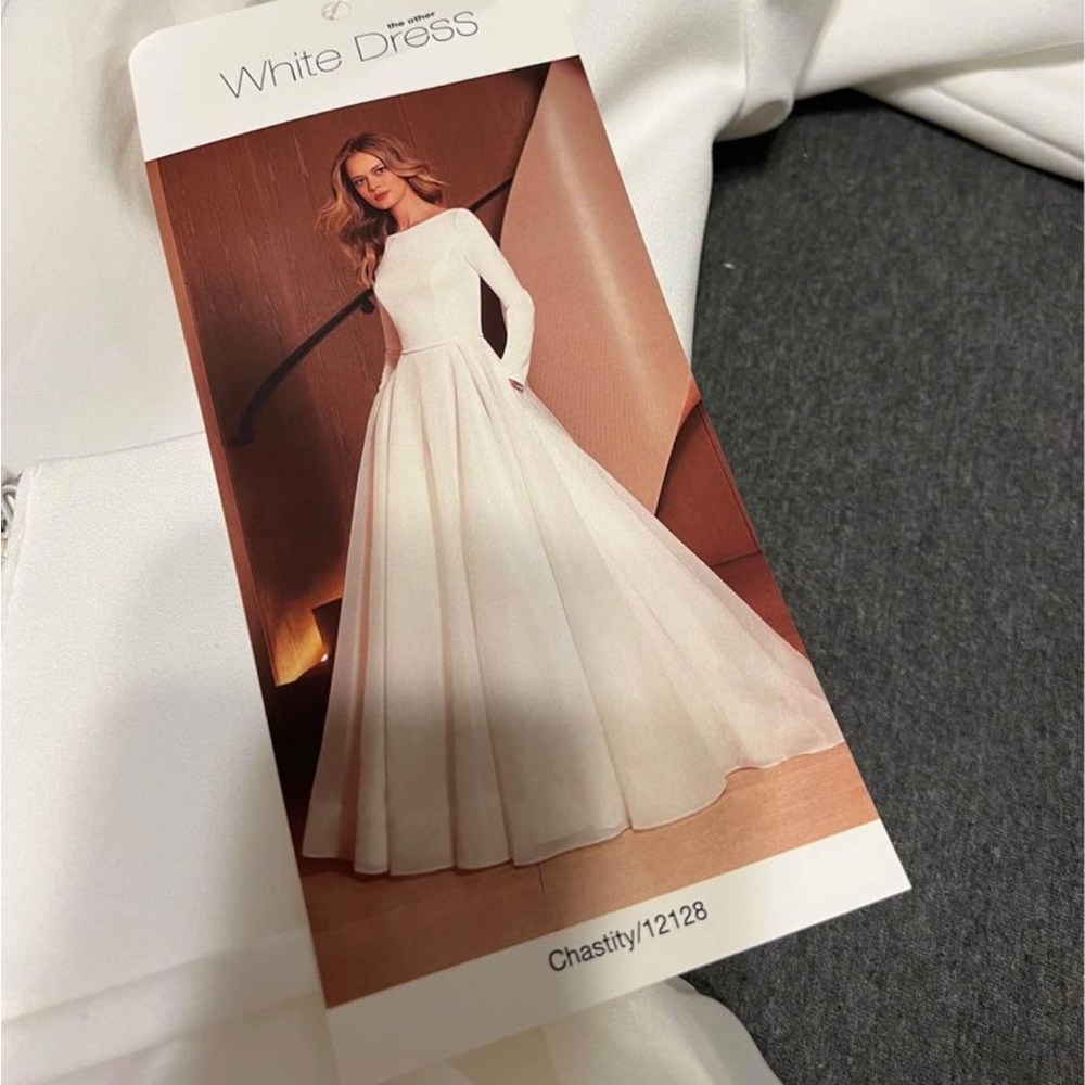 Wedding dress and veil for sale. Designer still sells both
